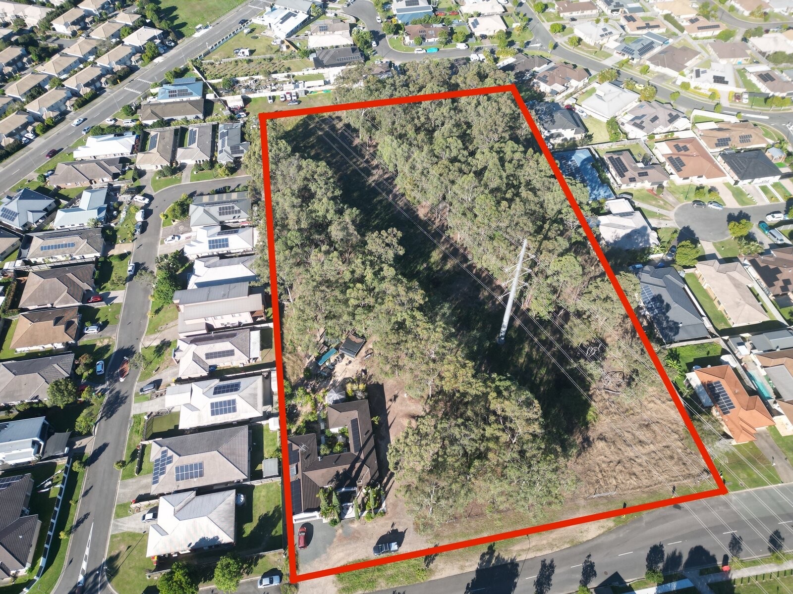 Aerial view of 161–169 Bush Tucker Road, Berrinba — subject site outlined
